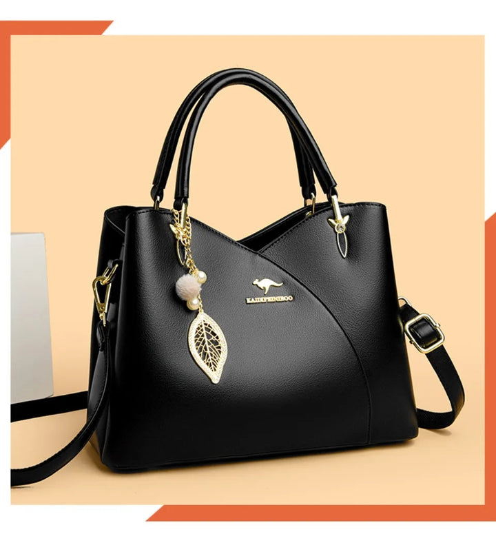 Elegant black shoulder bag with stylish charms