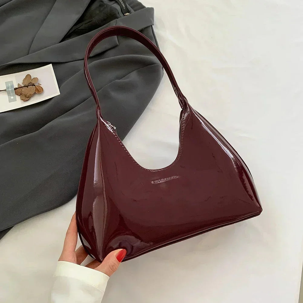 Elegant burgundy shoulder bag with a patent finish