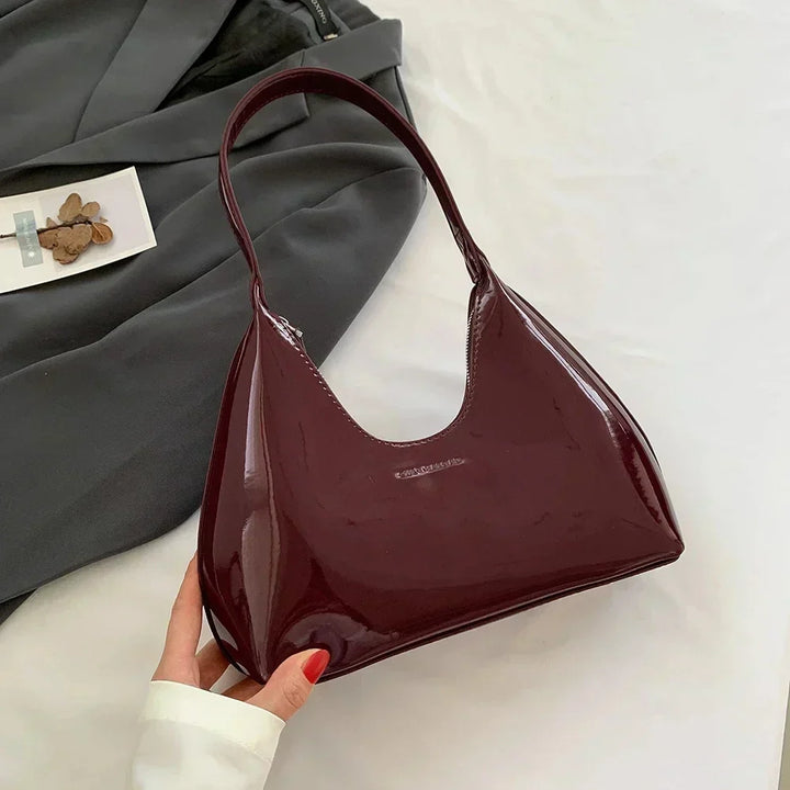 Elegant burgundy shoulder bag with a patent finish