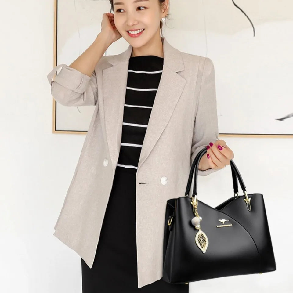 Elegant black shoulder bag with stylish charms