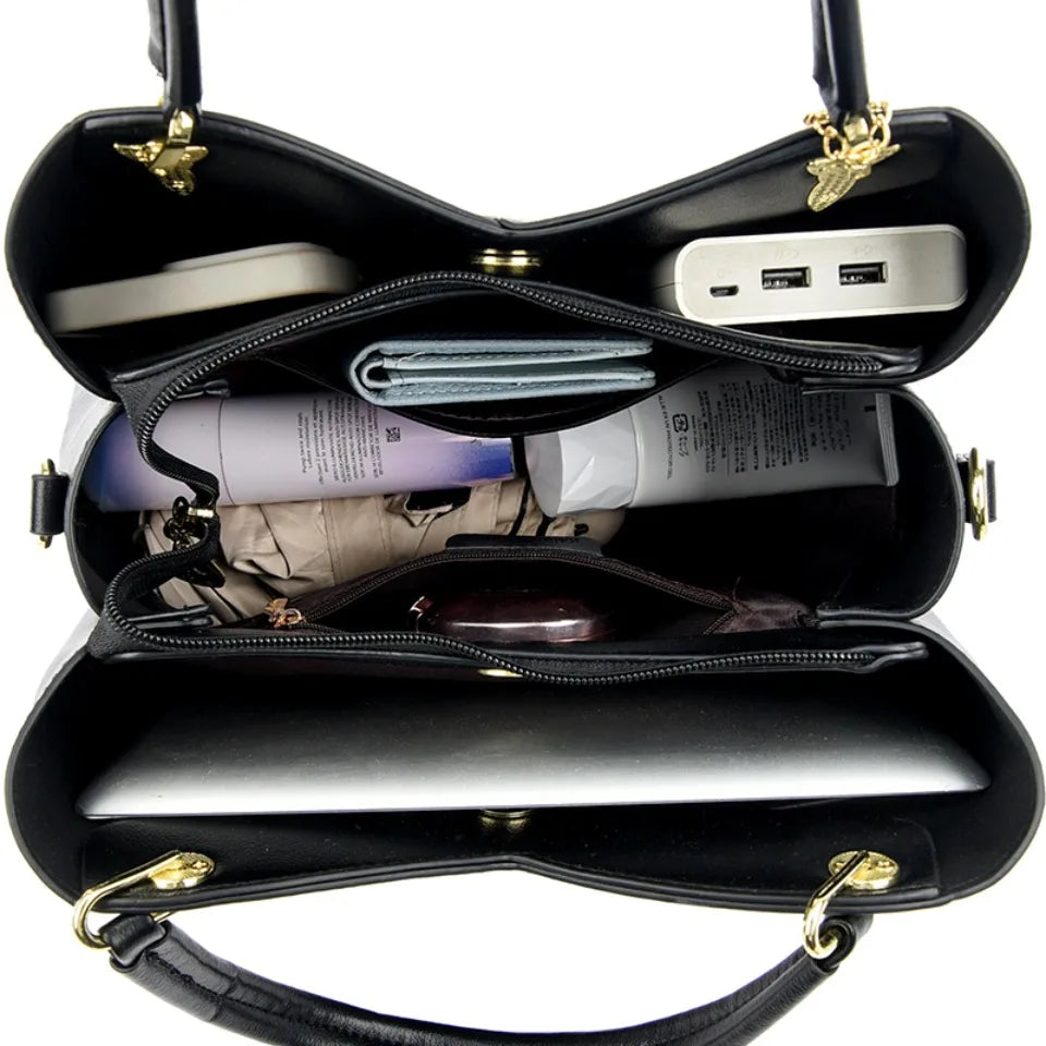 Elegant black shoulder bag with stylish charms