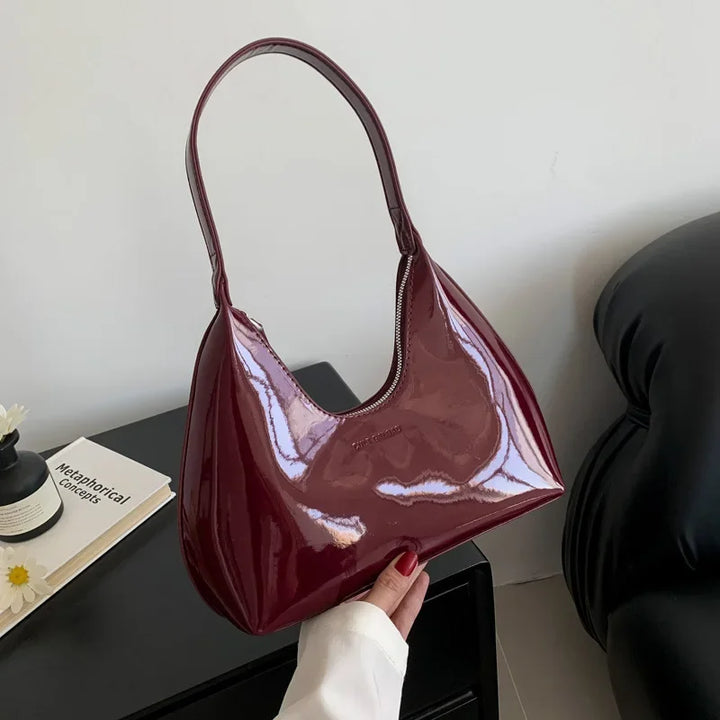 Elegant burgundy shoulder bag with a patent finish