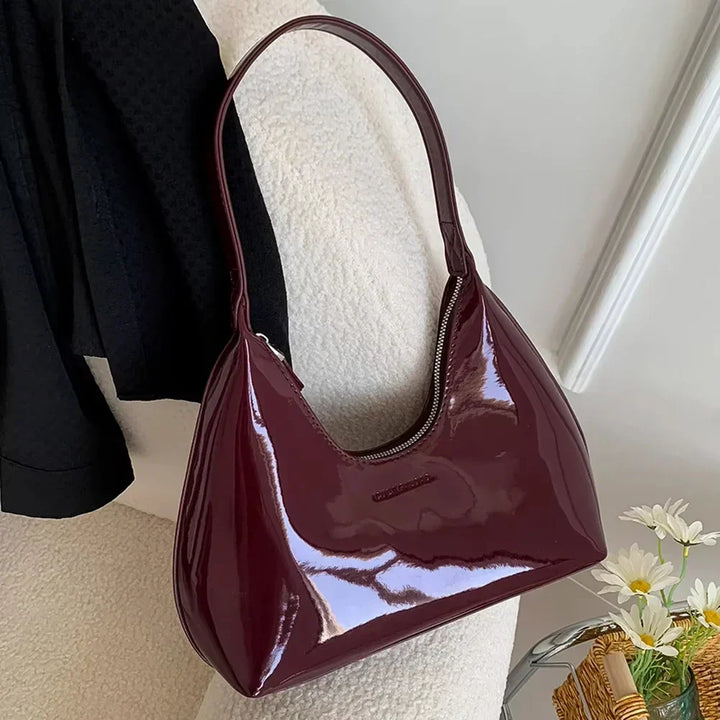 Elegant burgundy shoulder bag with a patent finish