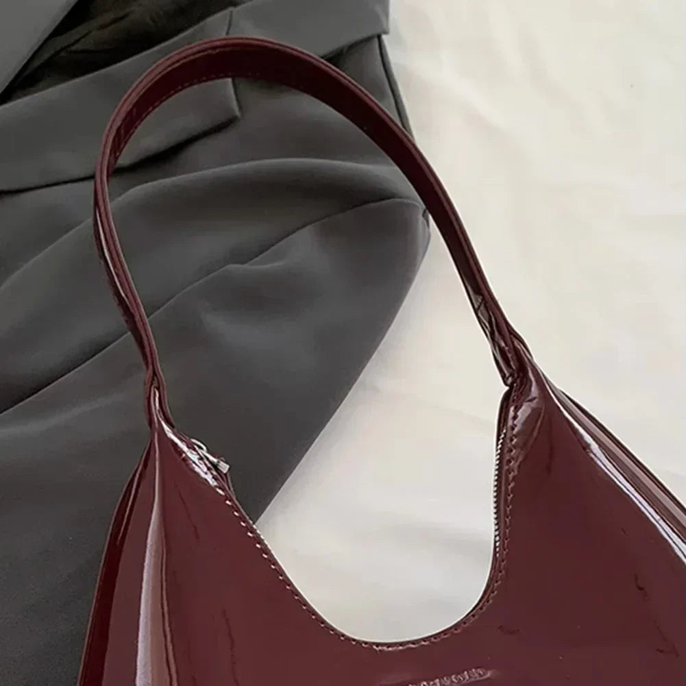 Elegant burgundy shoulder bag with a patent finish