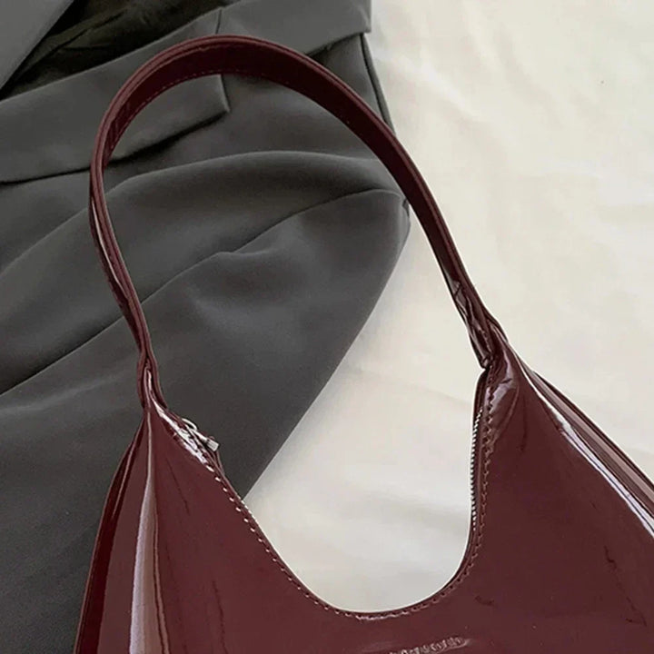 Elegant burgundy shoulder bag with a patent finish